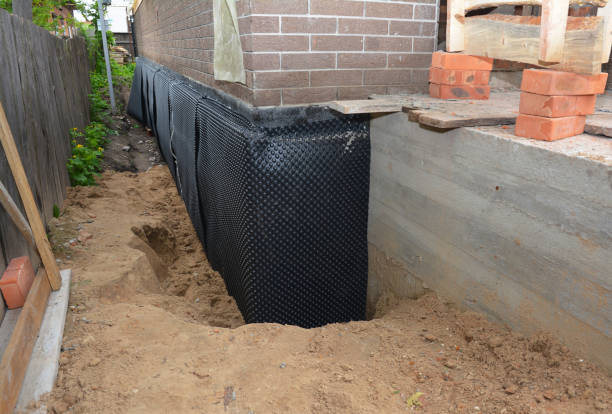 Happy homeowners after waterproofing job in Spivey
